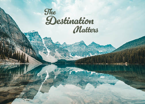 Front of a postcard. The Destination Matters. Mountian lake